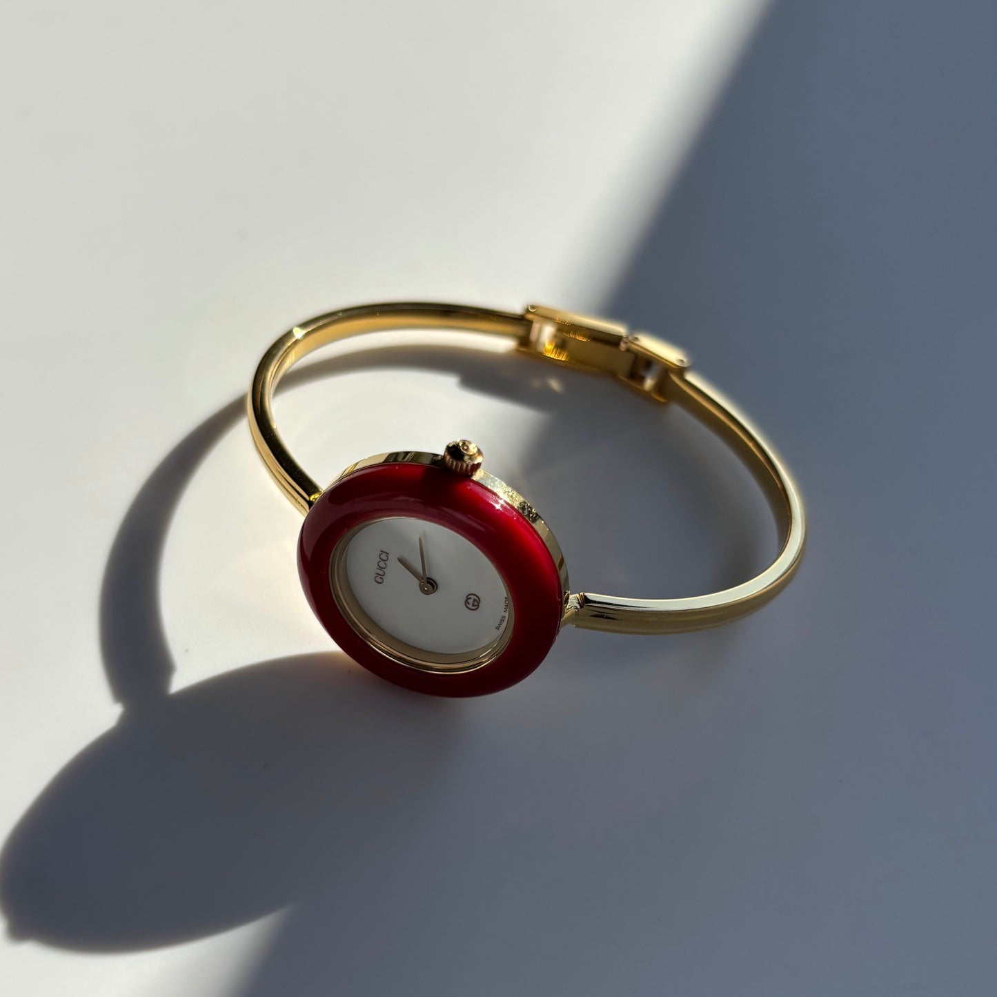 Gucci 1990s Interchangeable Bezel Gold Plated Bangle Watch with 12 bezels, case