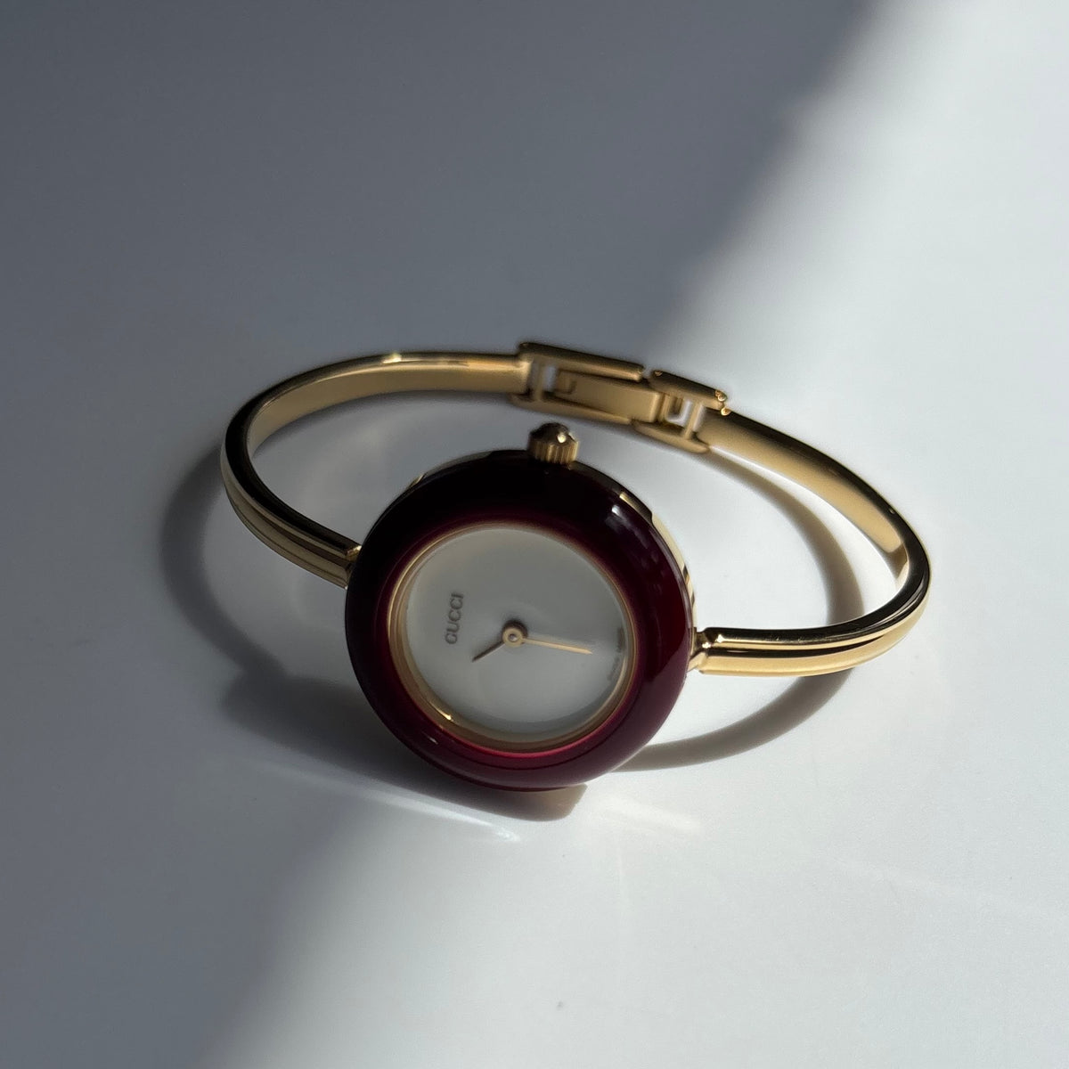 Gucci 1990s Interchangeable Bezel Gold Plated Bangle Watch with 12 bezels, case