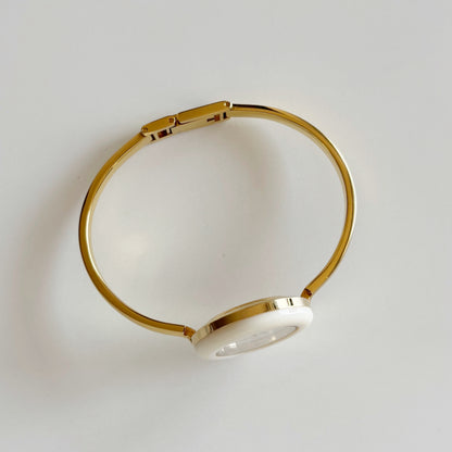 Gucci 1990s Interchangeable Bezel Gold Plated Bangle Watch with 12 bezels, case