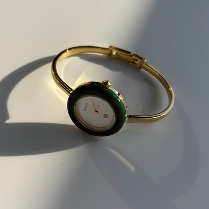 Gucci 1990s Interchangeable Bezel Gold Plated Bangle Watch with 12 bezels, case