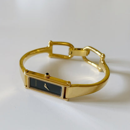 Gucci 1990s Black Dial Gold Plated Rectangular Bangle Watch