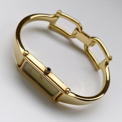 Gucci 1990s Gold Dial Gold Plated Rectangular Bangle Watch