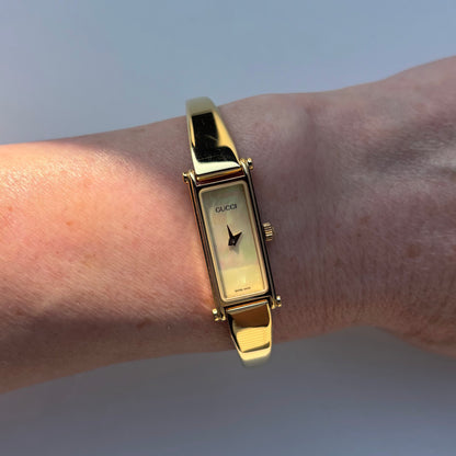 Gucci 1990s Seashell Rectangular Dial Gold Plated Bangle Watch
