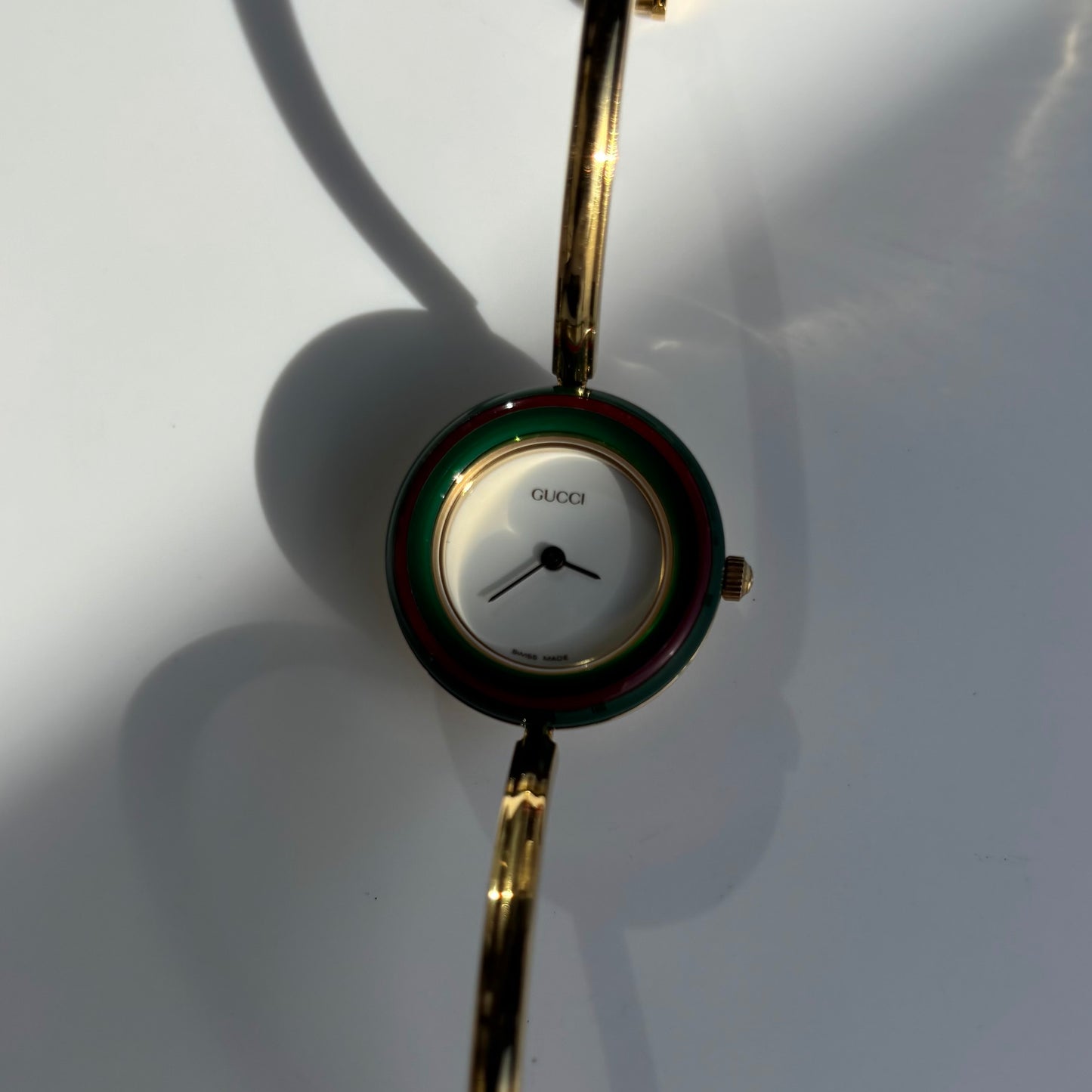 Gucci 1990s Interchangeable Bezel Gold Plated Bangle Watch with 12 bezels, case