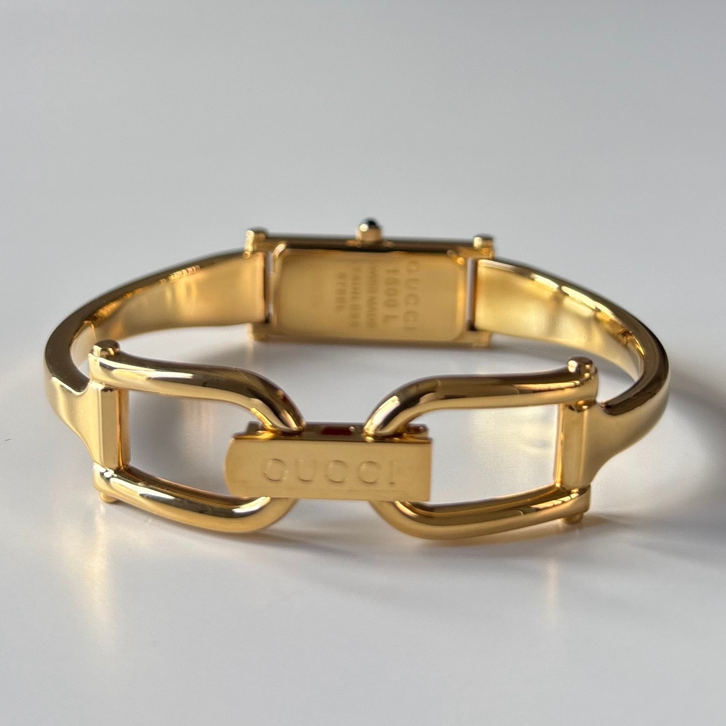Gucci 1990s Black Rectangular Dial Gold Plated Bangle Watch