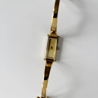 Gucci 1990s Gold Rectangular Dial Gold Plated Bangle Watch