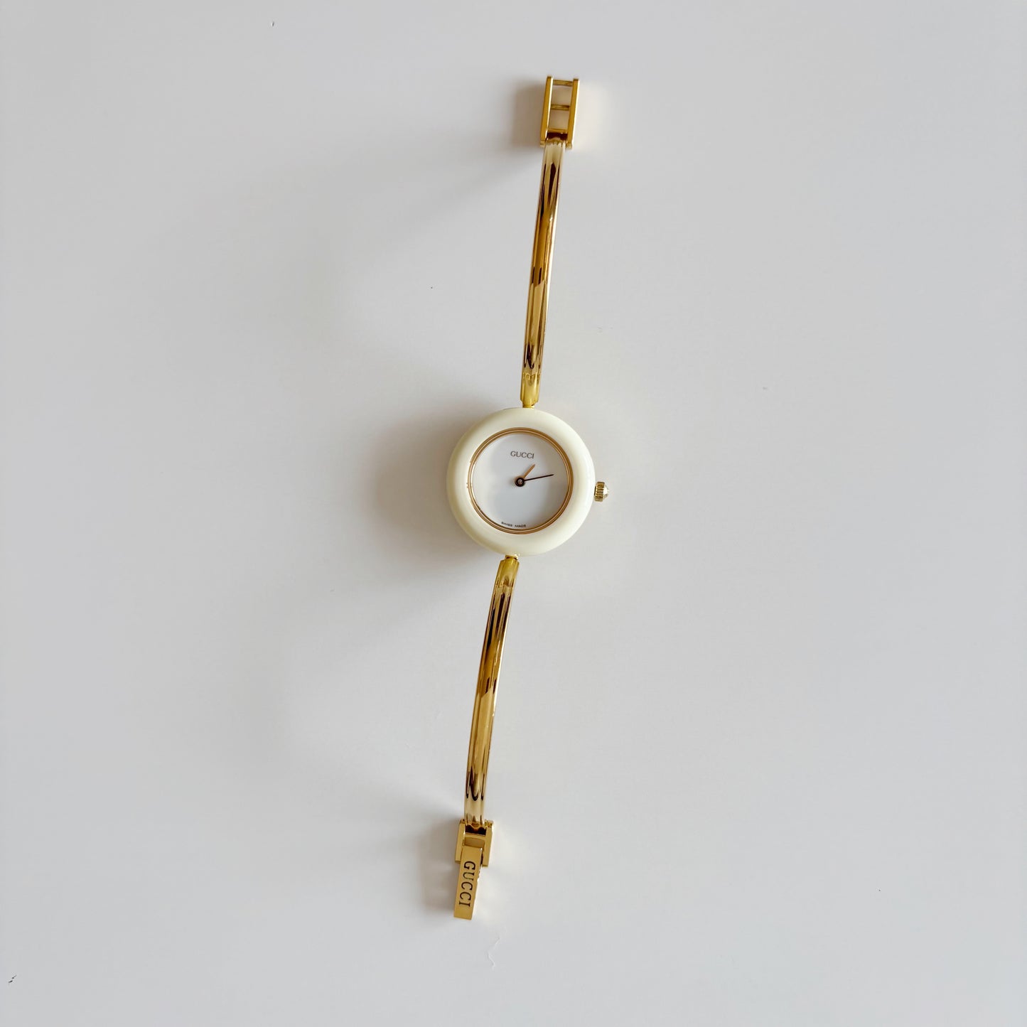 Gucci 1990s Interchangeable Bezel Gold Plated Bangle Watch with 12 bezels, case