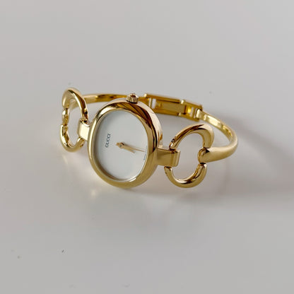 Gucci 1990s Seashell Oval Dial Gold-Plated Bangle Watch (Small)