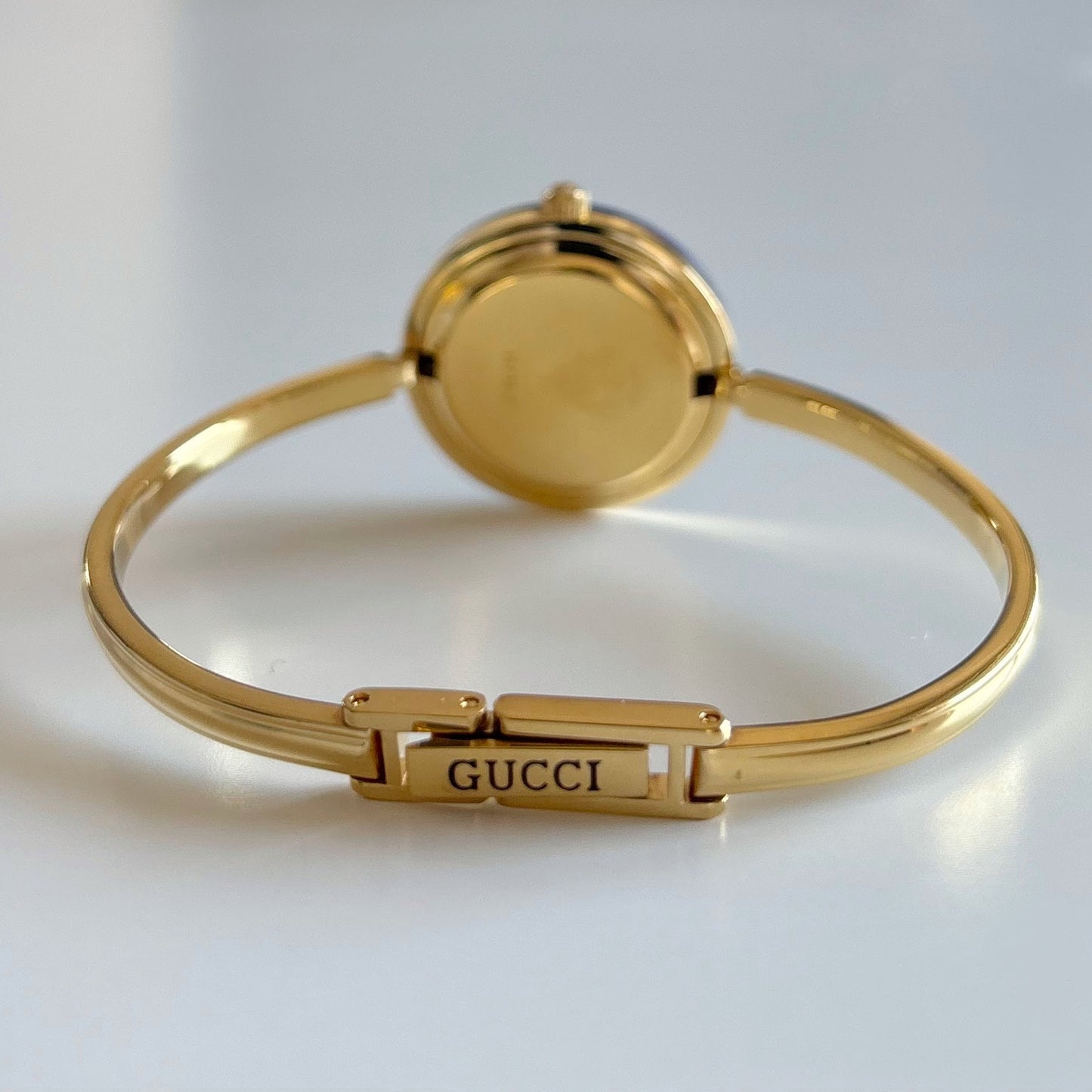 Gucci 1990s Interchangeable Bezel Gold Plated Bangle Watch with 12 bezels, case