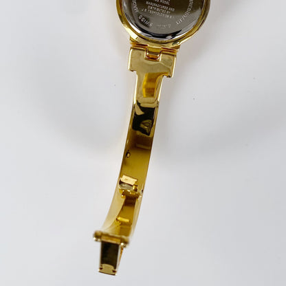 Givenchy 1990s Gold Plated Round Bangle Watch