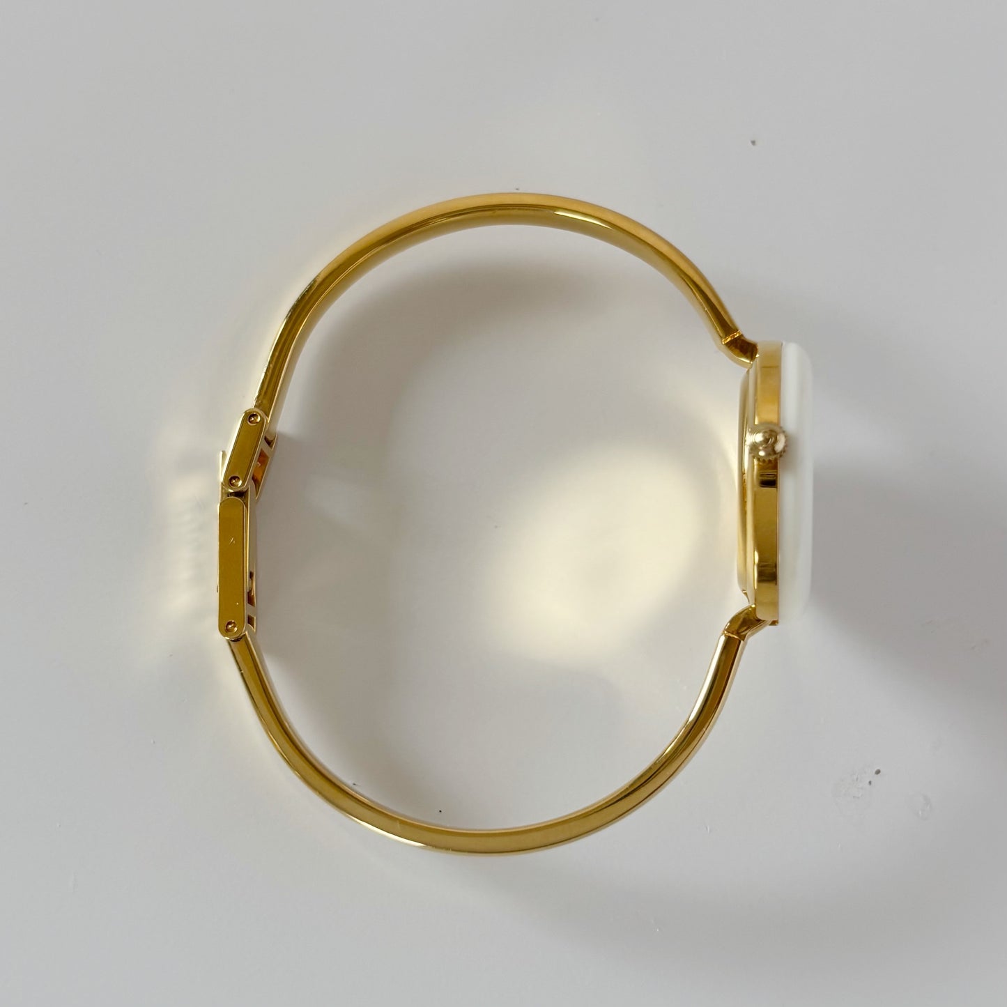 Gucci 1990s Interchangeable Bezel Gold Plated Bangle Watch with 12 bezels, case
