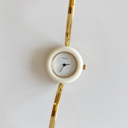 Gucci 1990s Interchangeable Bezel Gold Plated Bangle Watch with 12 bezels, case