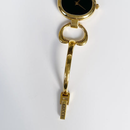 Gucci 1990s Black Dial Oval Gold Plated Bangle Watch