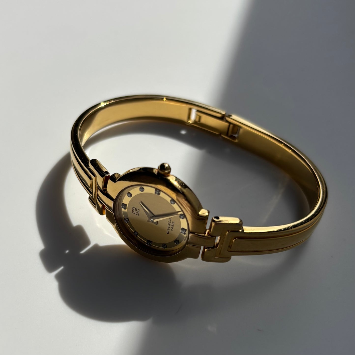 Givenchy 1990s Round Dial Gold Plated Bangle Watch