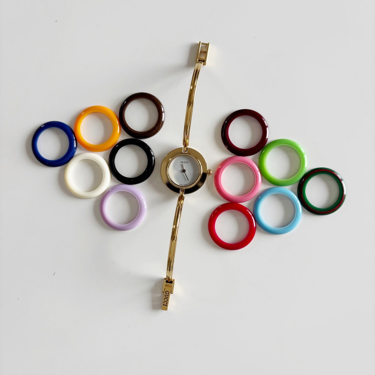 Gucci 1990s Interchangeable Bezel Gold Plated Bangle Watch with 12 bezels, case