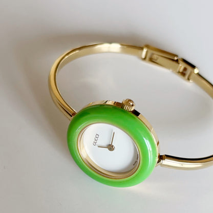 Gucci 1990s Interchangeable Bezel Gold Plated Bangle Watch with 12 bezels, case