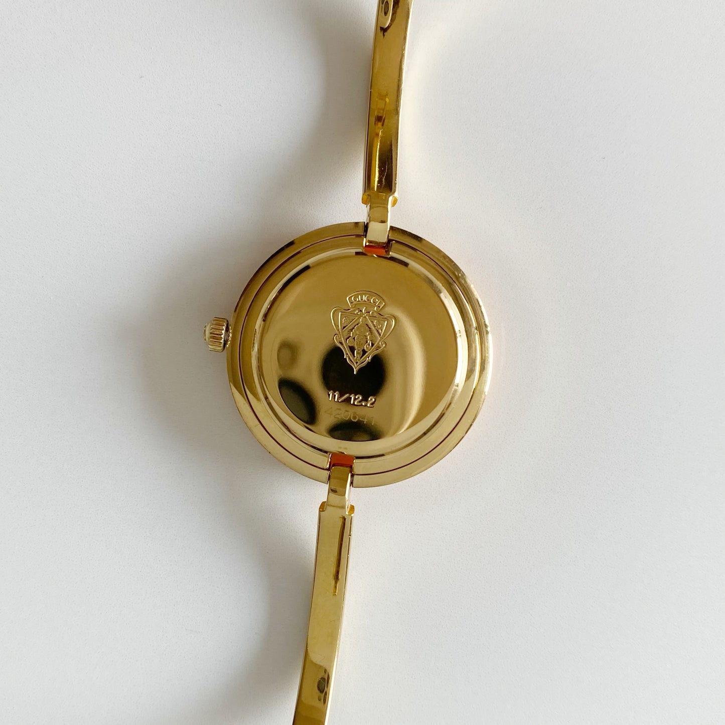 Gucci 1990s Interchangeable Bezel Gold Plated Bangle Watch with 12 bezels, case