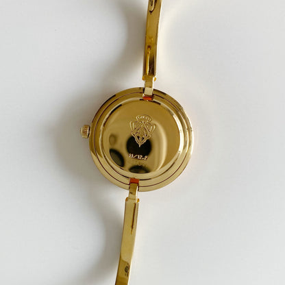 Gucci 1990s Interchangeable Bezel Gold Plated Bangle Watch with 12 bezels, case