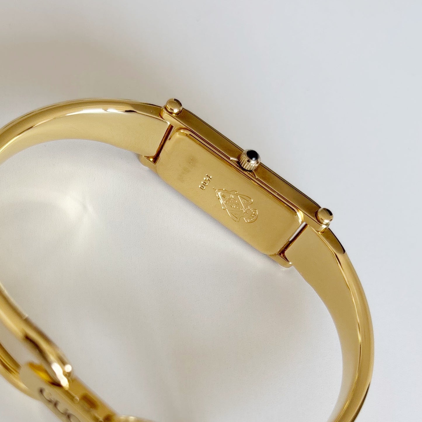 Gucci 1990s Rectangular Gold Dial Gold Plated Bangle Watch