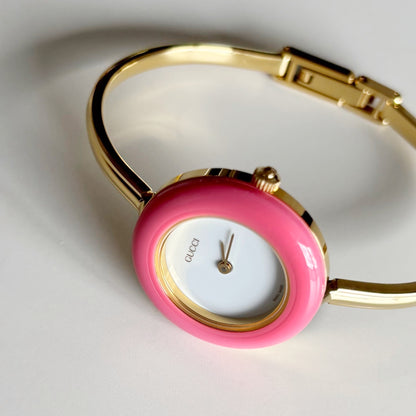 Gucci 1990s Interchangeable Bezel Gold Plated Bangle Watch with 12 bezels, case