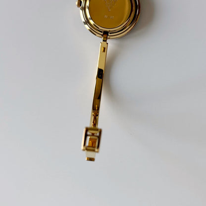 Gucci 1990s Interchangeable Bezel Gold Plated Bangle Watch with 12 bezels, case