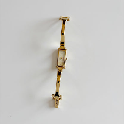 Gucci 1990s Seashell Rectangular Dial Gold Plated Bangle Watch
