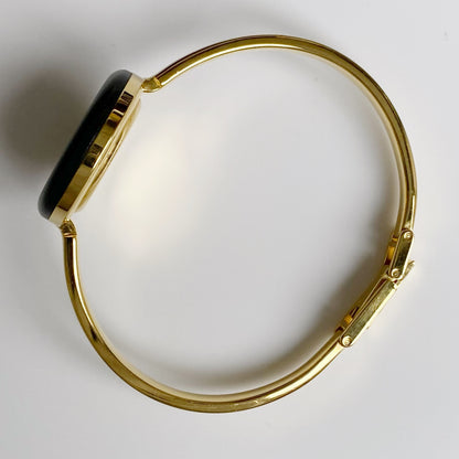 Gucci 1990s Interchangeable Bezel Gold Plated Bangle Watch with 12 bezels, case