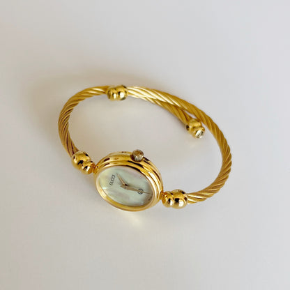 Gucci 1990s Seashell Dial Gold Plated Cable Bangle Watch
