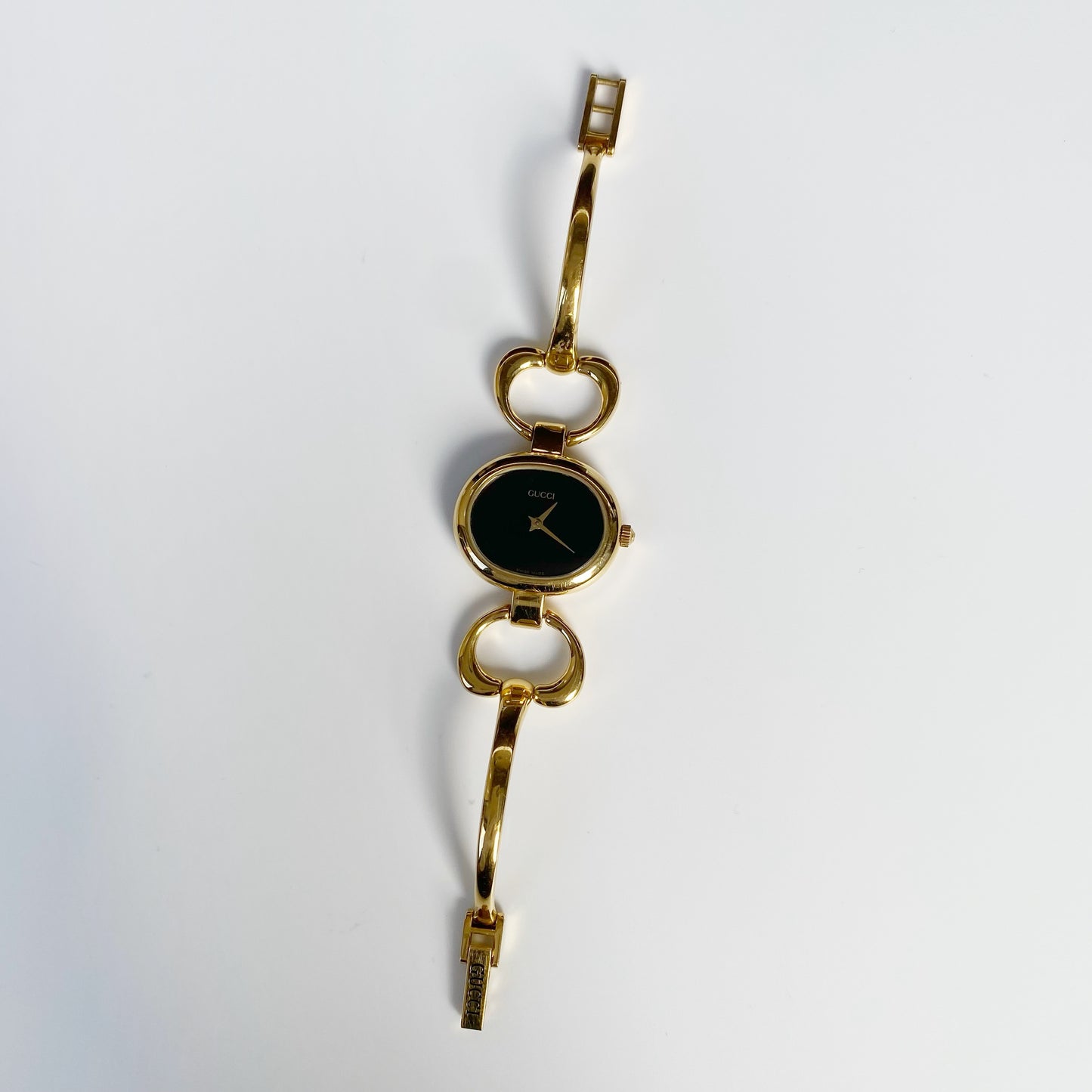 Gucci 1990s Black Dial Oval Gold Plated Bangle Watch