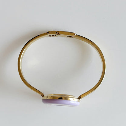 Gucci 1990s Interchangeable Bezel Gold Plated Bangle Watch with 12 bezels, case