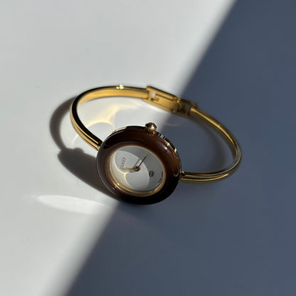 Gucci 1990s Interchangeable Bezel Gold Plated Bangle Watch with 12 bezels, case