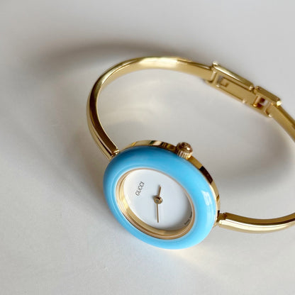 Gucci 1990s Interchangeable Bezel Gold Plated Bangle Watch with 12 bezels, case