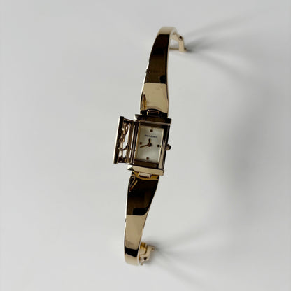 Yves Saint Laurent 1990s Peek-A-Boo Gold Plated Bangle Watch