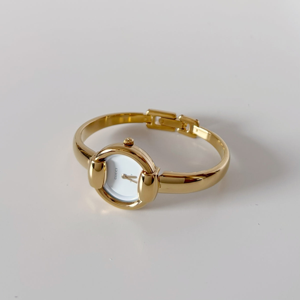 Gucci Round Dial Gold-Plated Bangle Watch