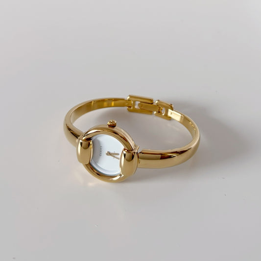 Gucci Round Dial Gold-Plated Bangle Watch