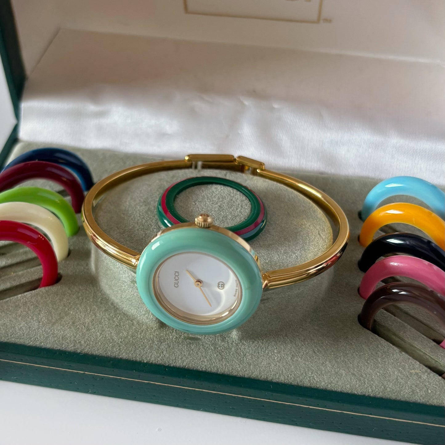 Gucci 1990s Interchangeable Bezel Gold Plated Bangle Watch with 12 bezels, case