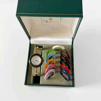 Gucci 1990s Interchangeable Bezel Gold Plated Bangle Watch with 12 bezels, case