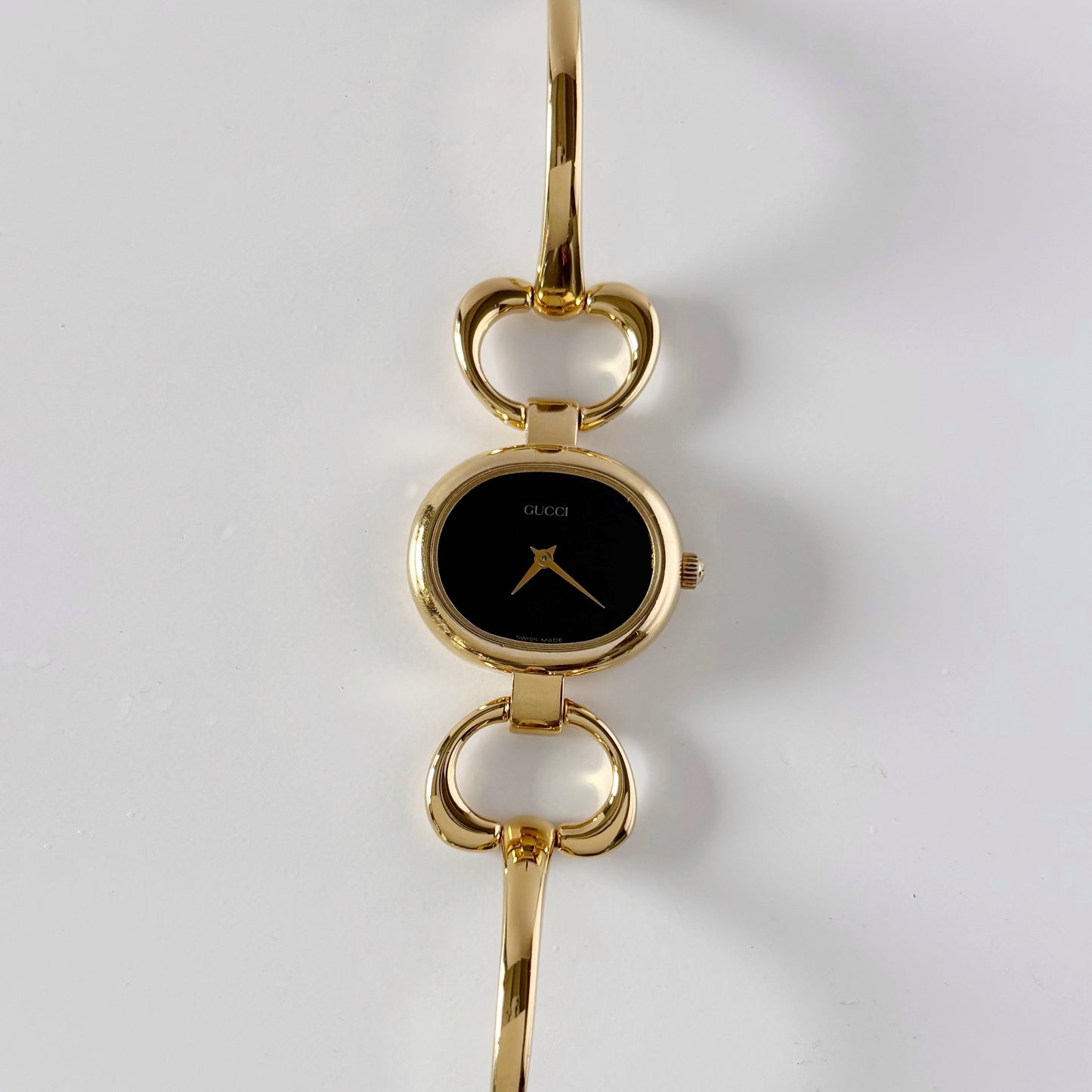 Gucci 1990s Oval Black Dial Gold Plated Bangle Watch (Small)