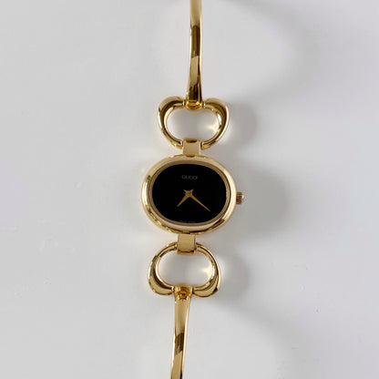 Gucci 1990s Oval Black Dial Gold Plated Bangle Watch (Small)