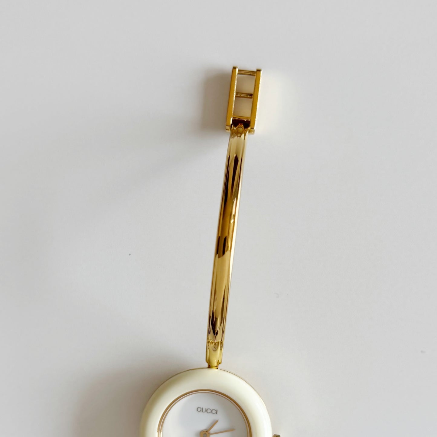 Gucci 1990s Interchangeable Bezel Gold Plated Bangle Watch with 12 bezels, case