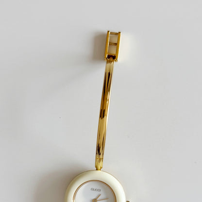 Gucci 1990s Interchangeable Bezel Gold Plated Bangle Watch with 12 bezels, case