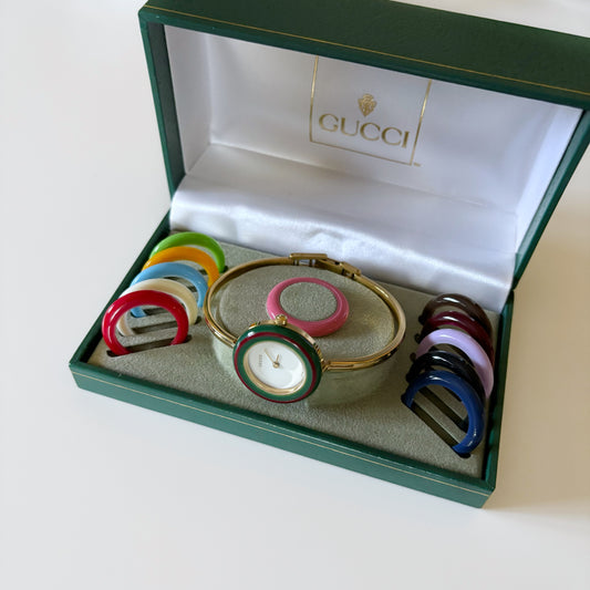 Gucci 1990s Interchangeable Bezel Gold Plated Bangle Watch with 12 bezels, box