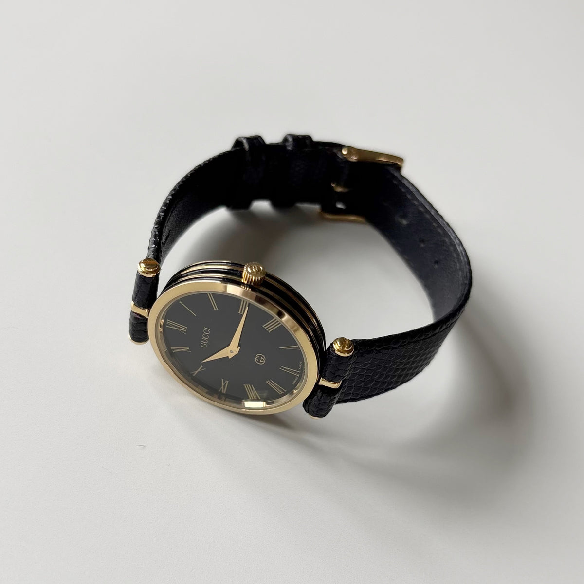 Gucci 1980s Round Black Dial Gold-Plated Watch (Large)