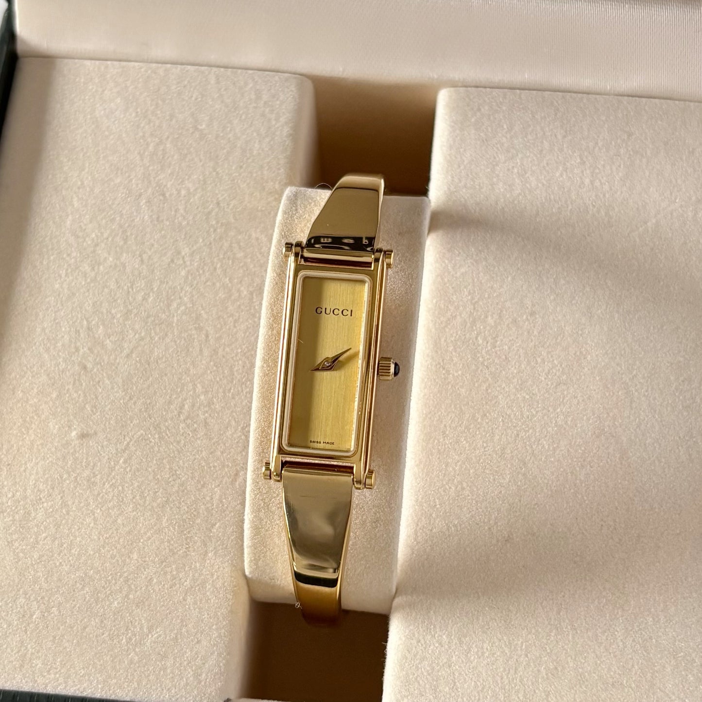 Gucci 1990s Rectangular Gold Dial Gold Plated Bangle Watch