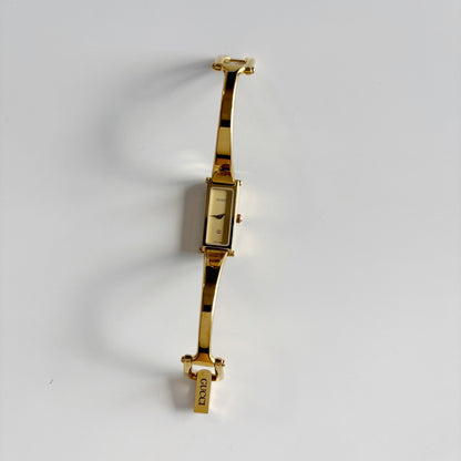 Gucci 1990s Gold Rectangular Dial Gold Plated Bangle Watch