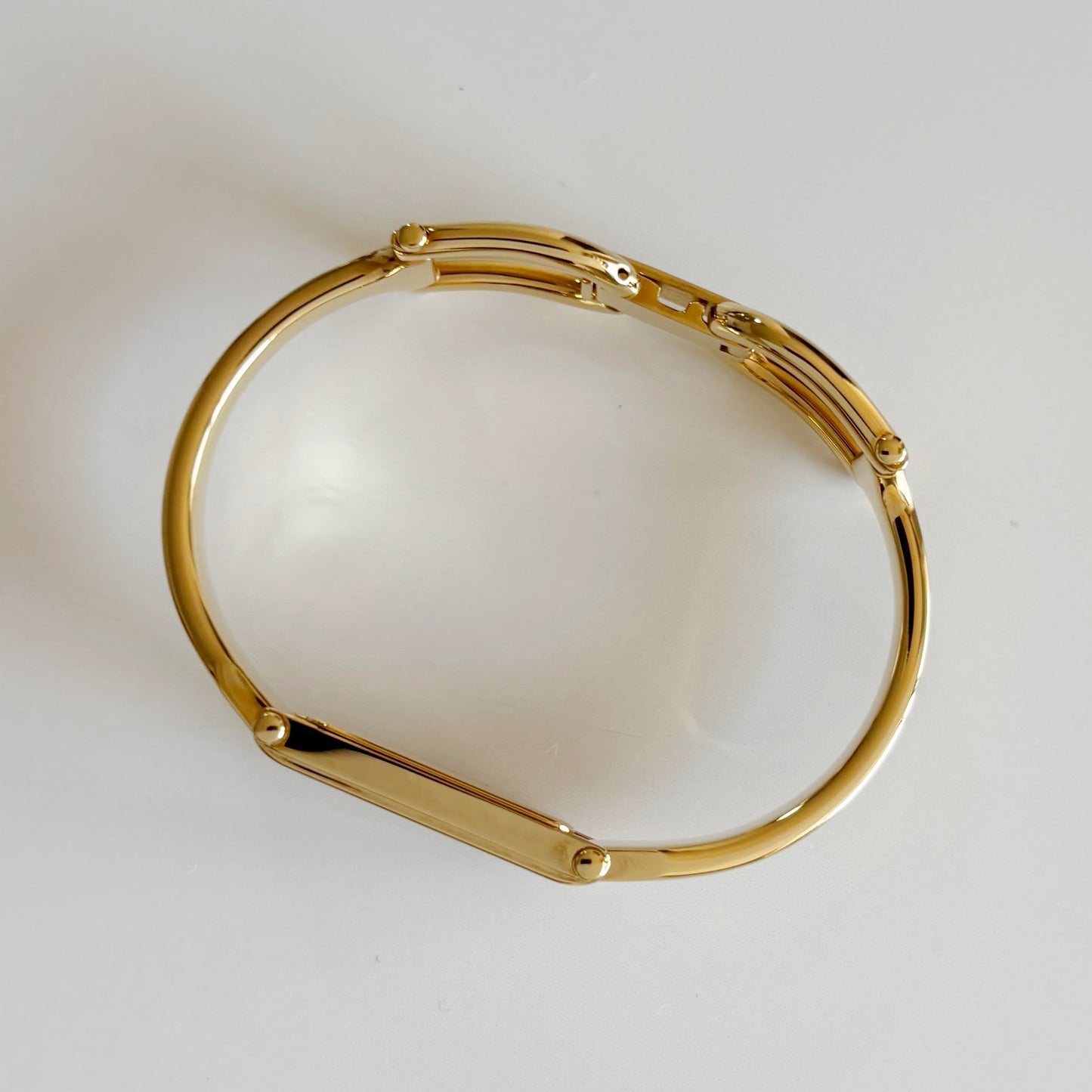 Gucci 1990s Rectangular Dial Gold Plated Bangle Watch
