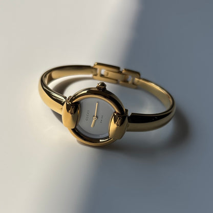 Gucci Round Dial Gold-Plated Bangle Watch
