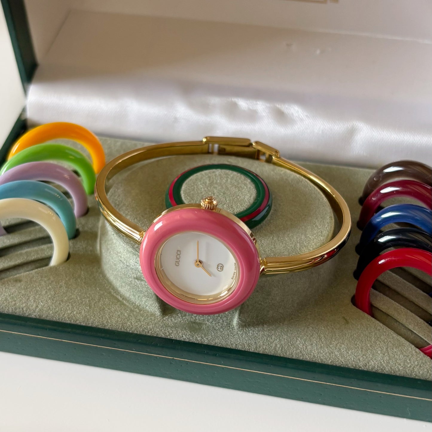 Gucci 1990s Interchangeable Bezel Gold Plated Bangle Watch with 12 bezels, case