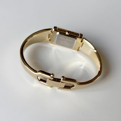 Yves Saint Laurent 1990s Peek-A-Boo Gold Plated Bangle Watch