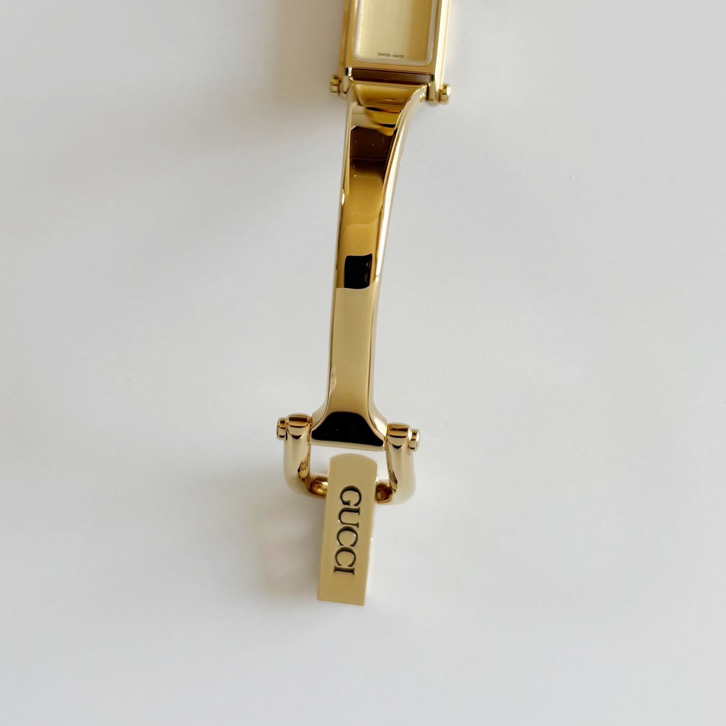 Gucci 1990s Rectangular Dial Gold Plated Bangle Watch